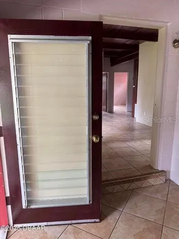 a view of an empty room with a window