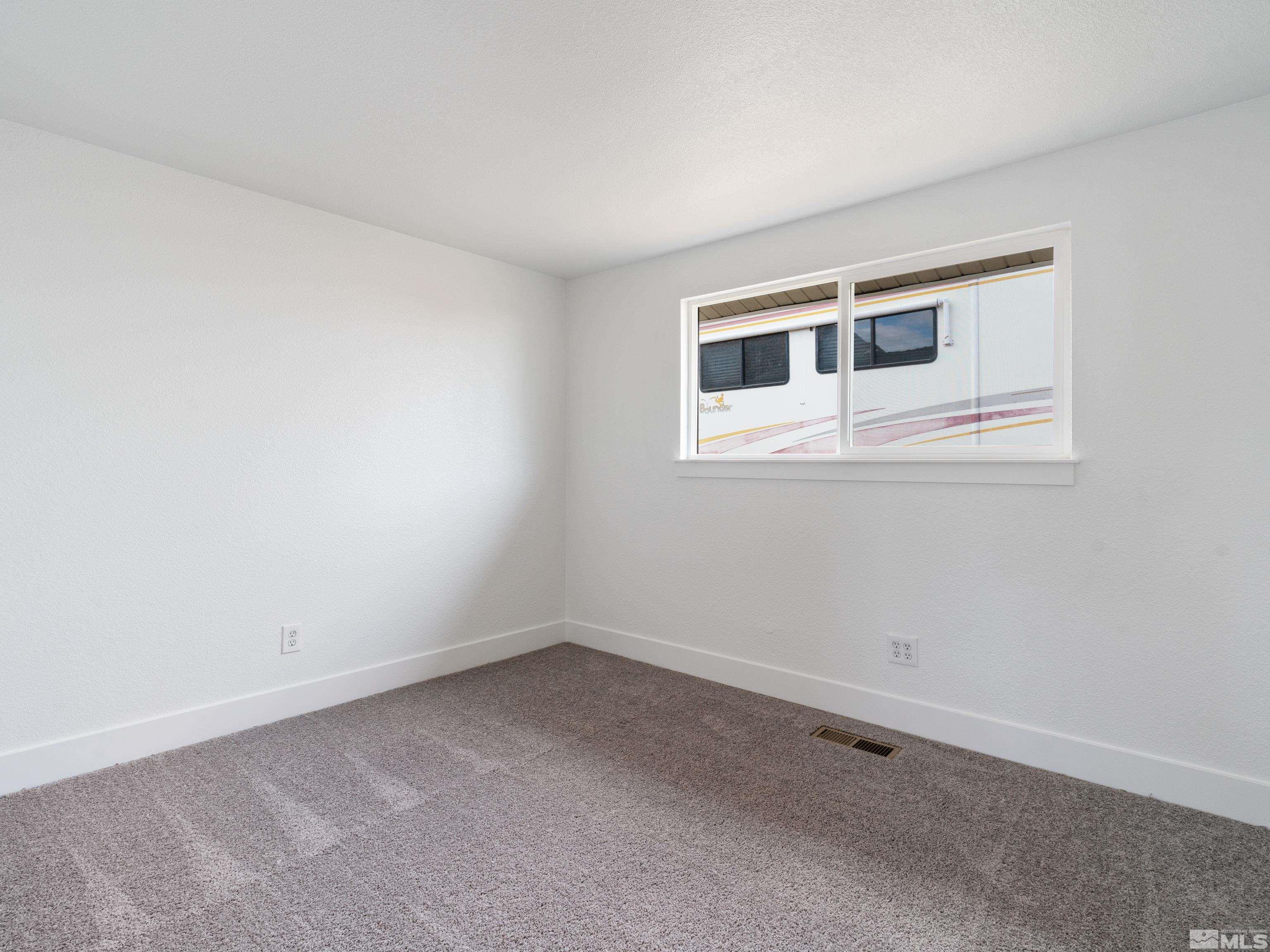 9485 Fremont Way Reno, NV 89506 - Photo 12 of 25 a view of an empty room with a window