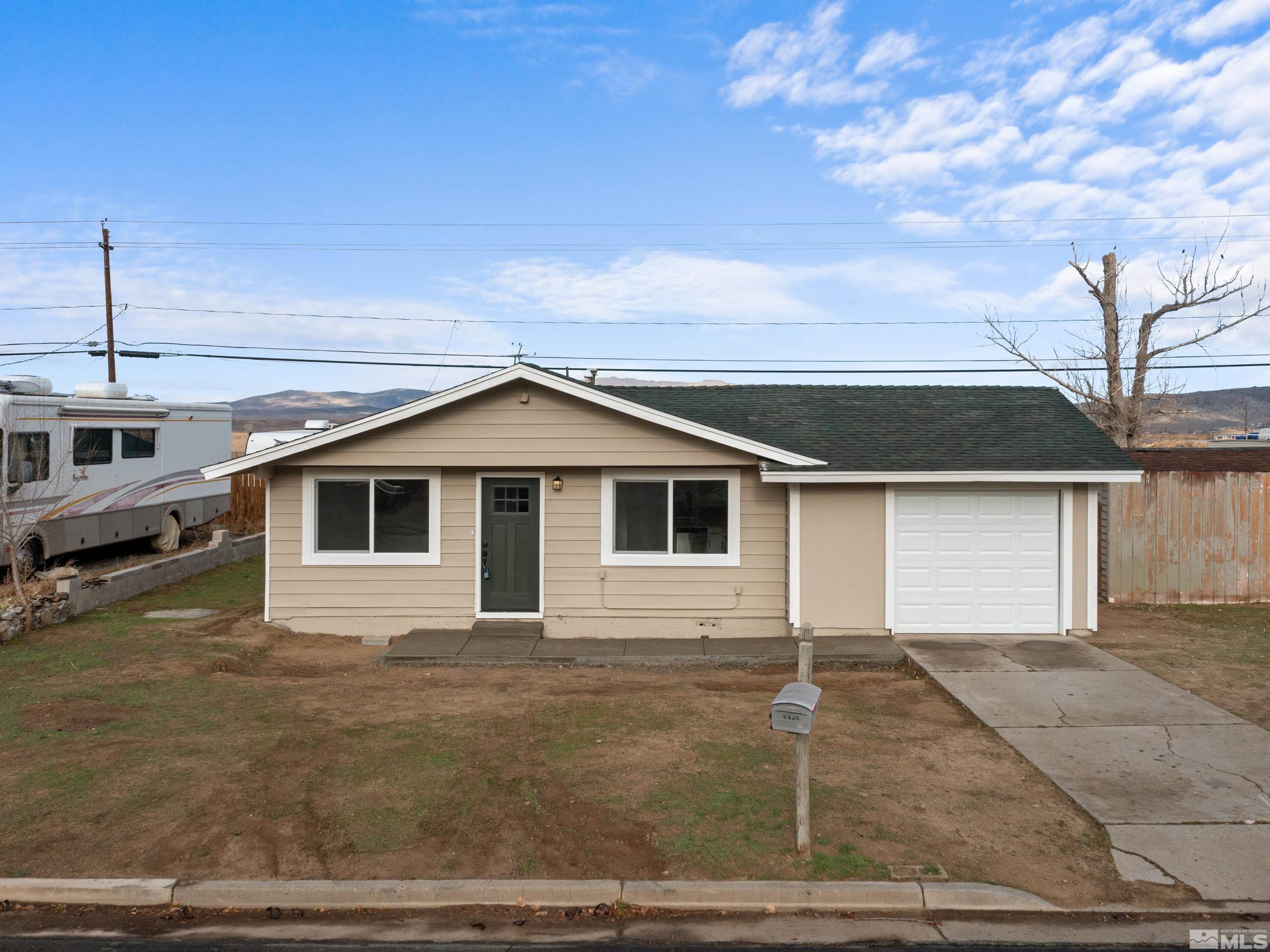 9485 Fremont Way Reno, NV 89506 - Photo 23 of 25 a front view of a house with garage