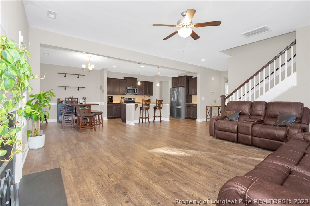 101 Carousel Street West End, NC 27376 - Photo 11 of 50 a living room with furniture and kitchen view