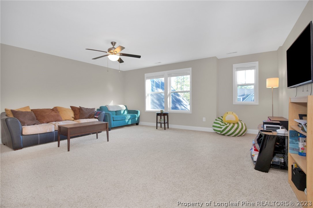 101 Carousel Street West End, NC 27376 - Photo 20 of 50 a bedroom with furniture and a flat screen tv