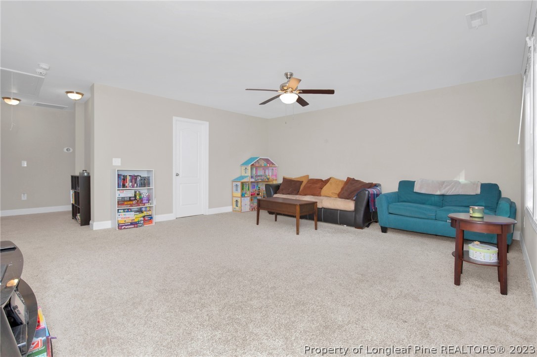 101 Carousel Street West End, NC 27376 - Photo 21 of 50 a view of a livingroom with furniture and a piano