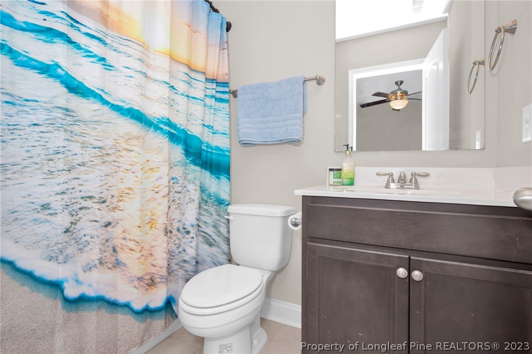101 Carousel Street West End, NC 27376 - Photo 28 of 50 a bathroom with a sink toilet and mirror