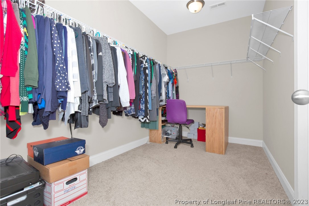 101 Carousel Street West End, NC 27376 - Photo 33 of 50 a view of a room with furniture and clothes