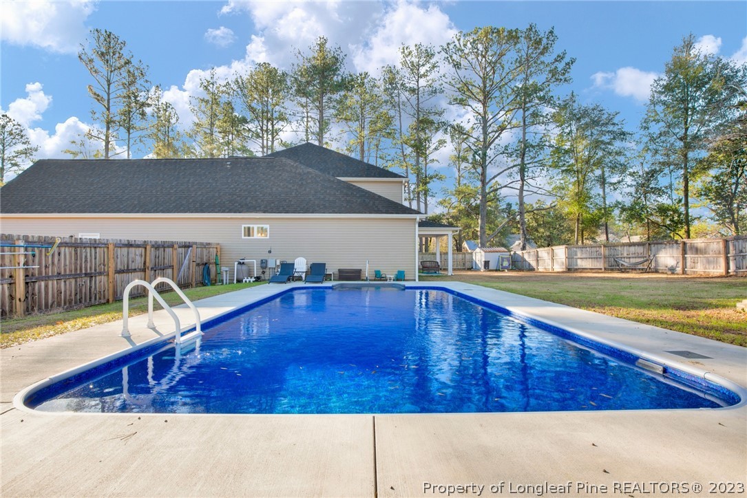 101 Carousel Street West End, NC 27376 - Photo 38 of 50 a view of a swimming pool with a patio