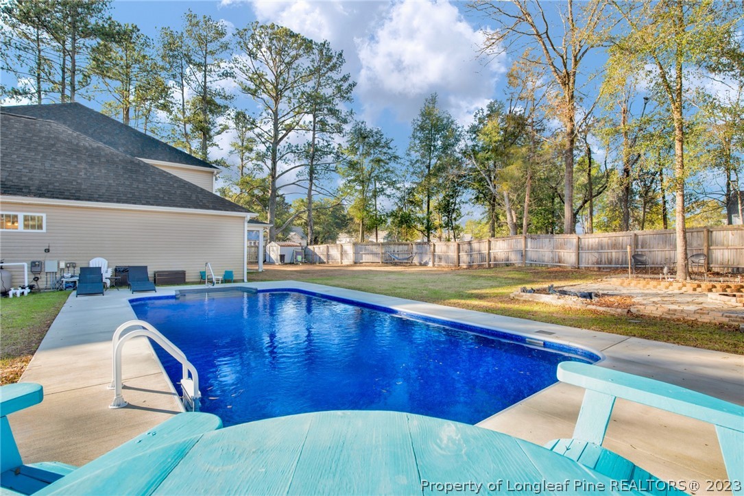 101 Carousel Street West End, NC 27376 - Photo 39 of 50 a view of a swimming pool with a patio