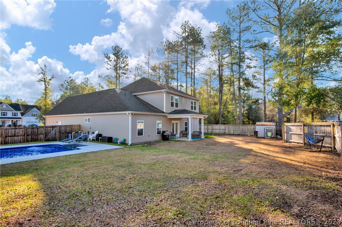 101 Carousel Street West End, NC 27376 - Photo 42 of 50 a view of a house with a big yard and large trees