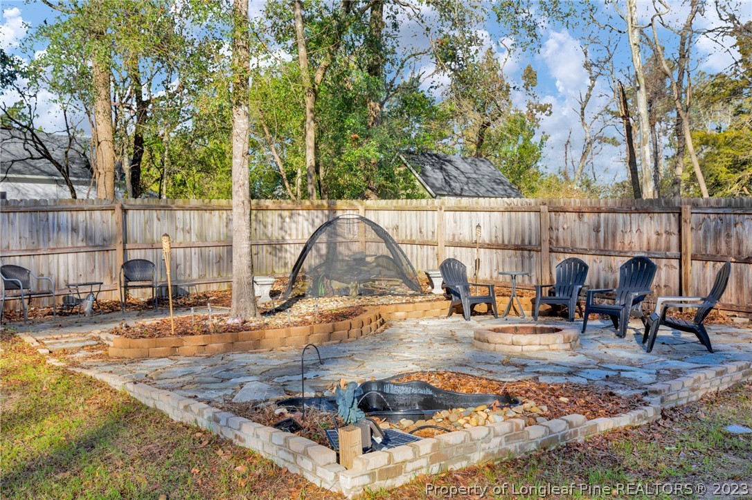 101 Carousel Street West End, NC 27376 - Photo 48 of 50 a view of a swimming pool with a patio and sitting space