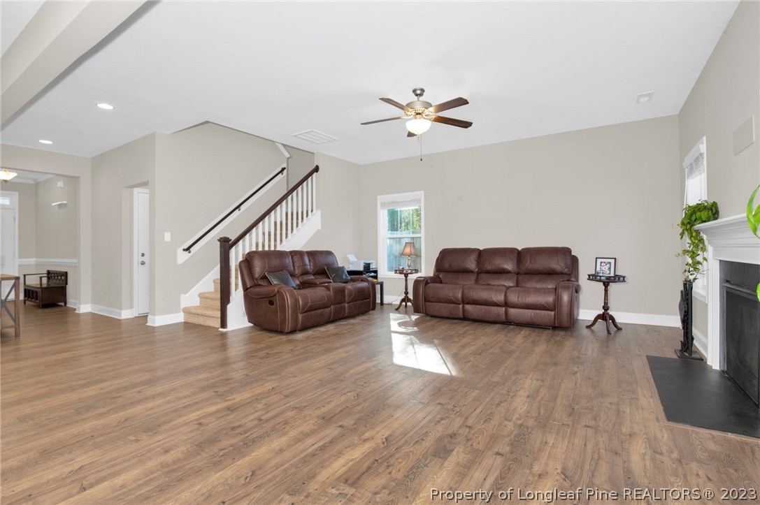 101 Carousel Street West End, NC 27376 - Photo 10 of 50 a living room with furniture and a wooden floor