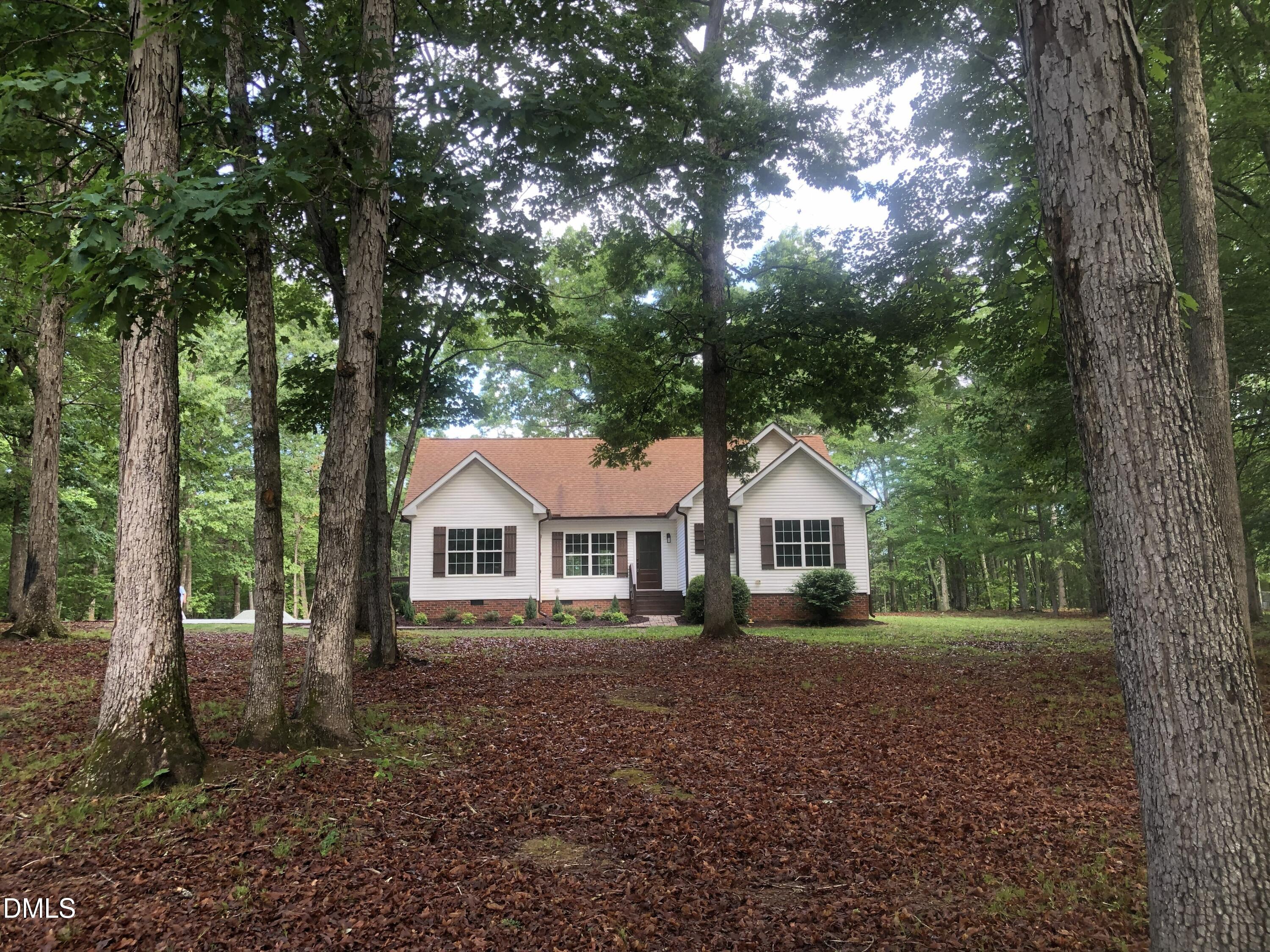 95 Smith Taylor Trail Roxboro, NC 27574 - Photo 13 of 47 a front view of a house with a garden