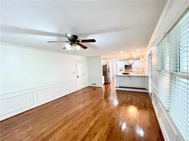 a view of a livingroom with wooden floor