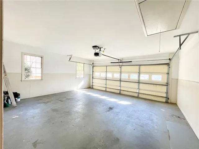 a view of a livingroom with furniture and a window