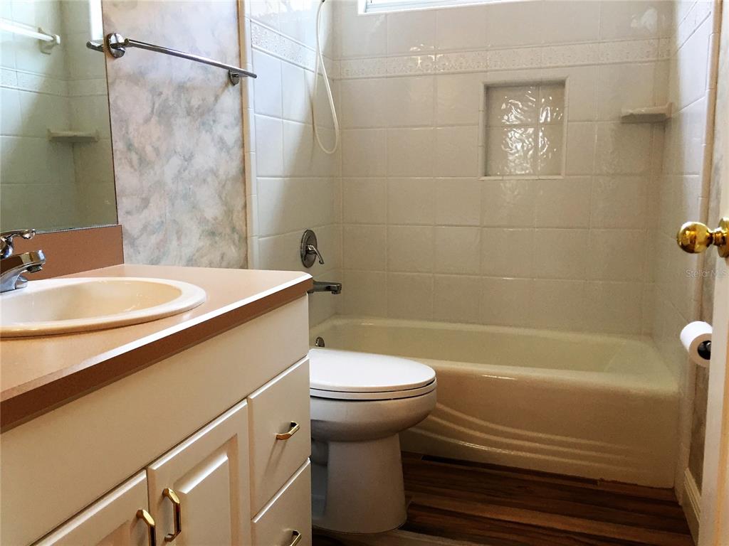 4414 Southwest 91st Drive Gainesville, FL 32608 - Photo 17 of 19 a bathroom with a sink and a toilet