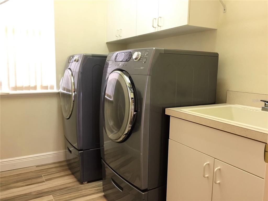 4414 Southwest 91st Drive Gainesville, FL 32608 - Photo 18 of 19 a utility room with dryer and washer