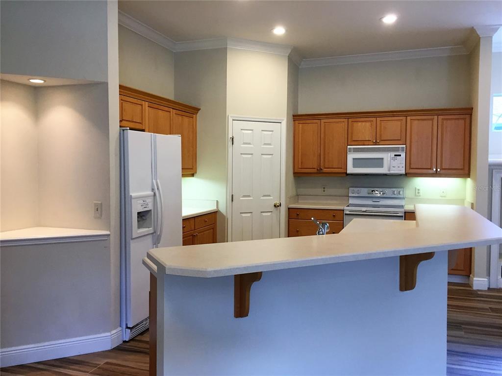 4414 Southwest 91st Drive Gainesville, FL 32608 - Photo 8 of 19 a kitchen with stainless steel appliances a refrigerator and a stove