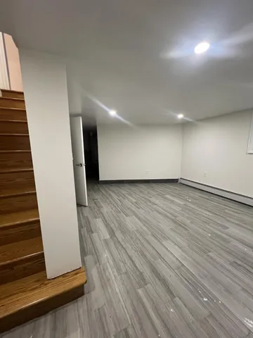 an empty room with wooden floor