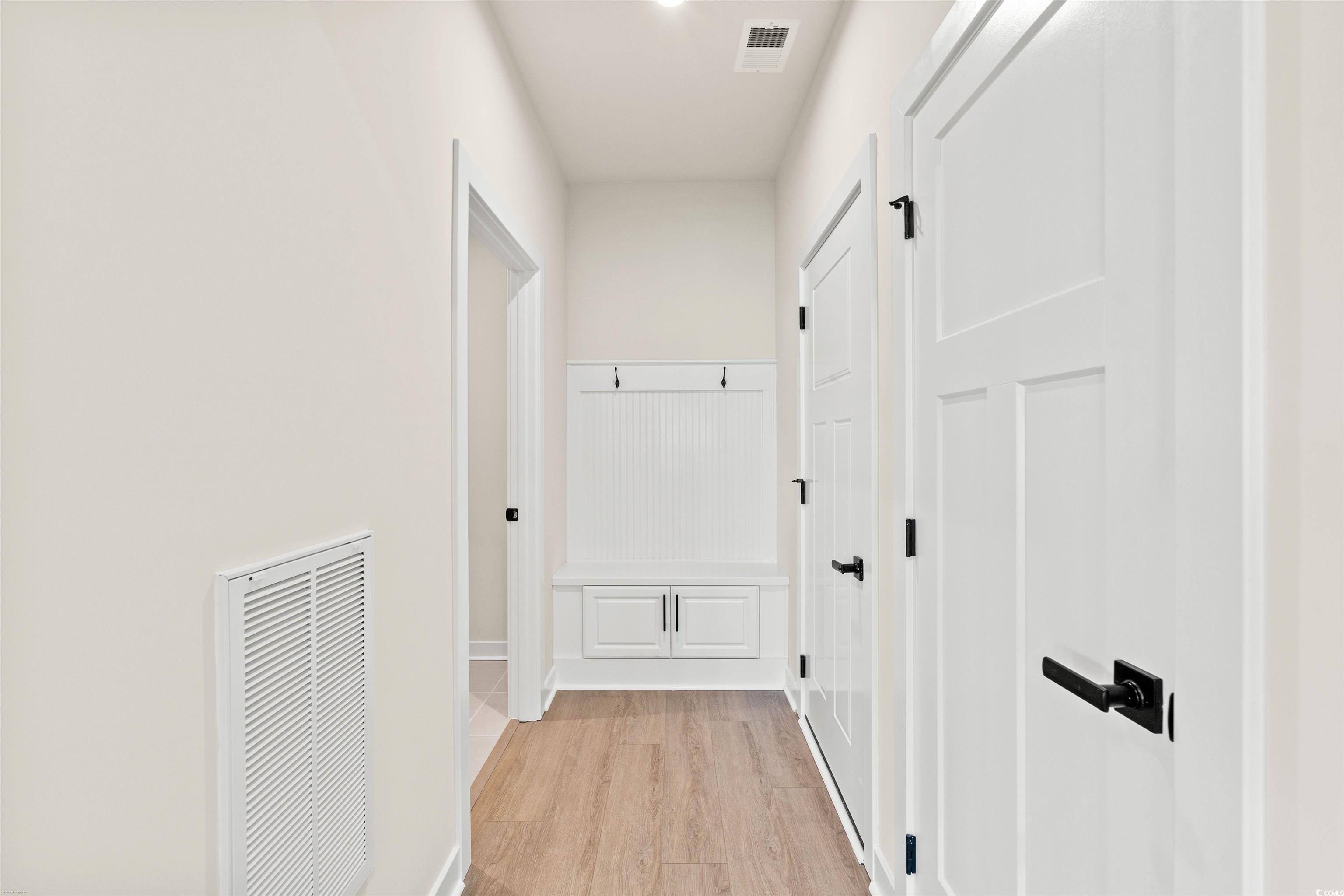 7076 Denim Loop Myrtle Beach, SC 29579 - Photo 12 of 27 Corridor with light wood-style floors and a heating unit