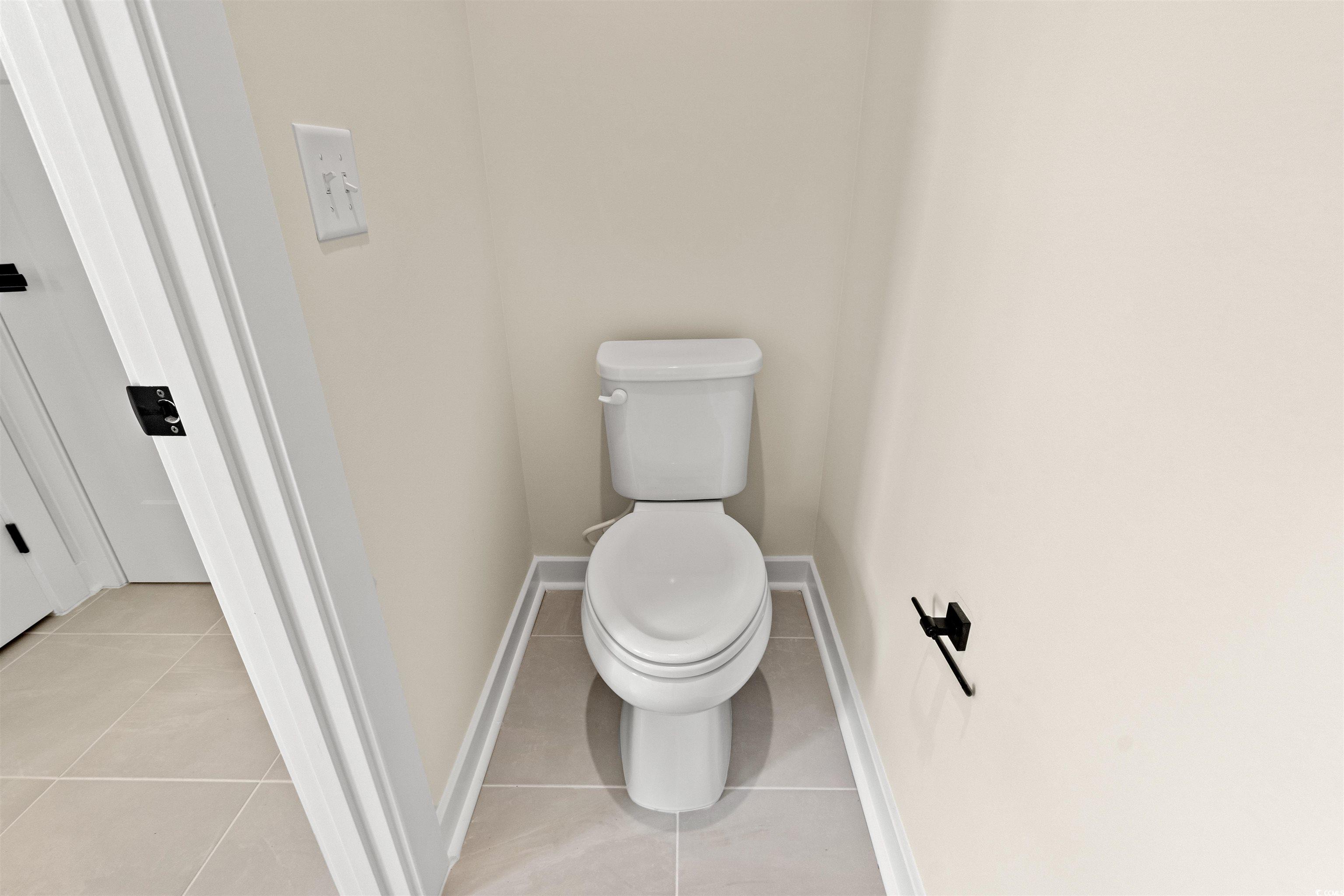 7076 Denim Loop Myrtle Beach, SC 29579 - Photo 17 of 27 Bathroom featuring tile patterned floors and toilet
