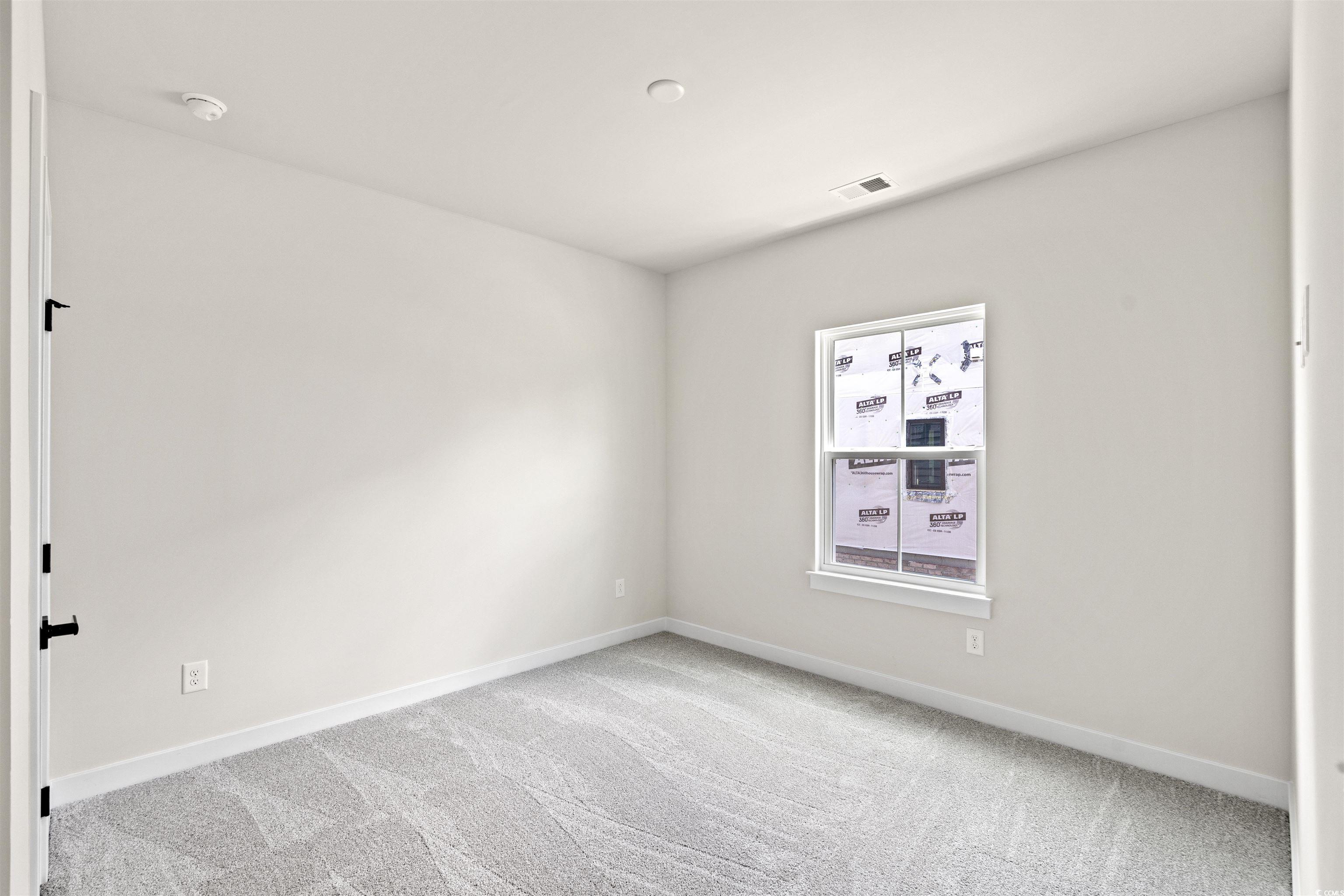 7076 Denim Loop Myrtle Beach, SC 29579 - Photo 18 of 27 Unfurnished room with carpet floors and a smoke detector