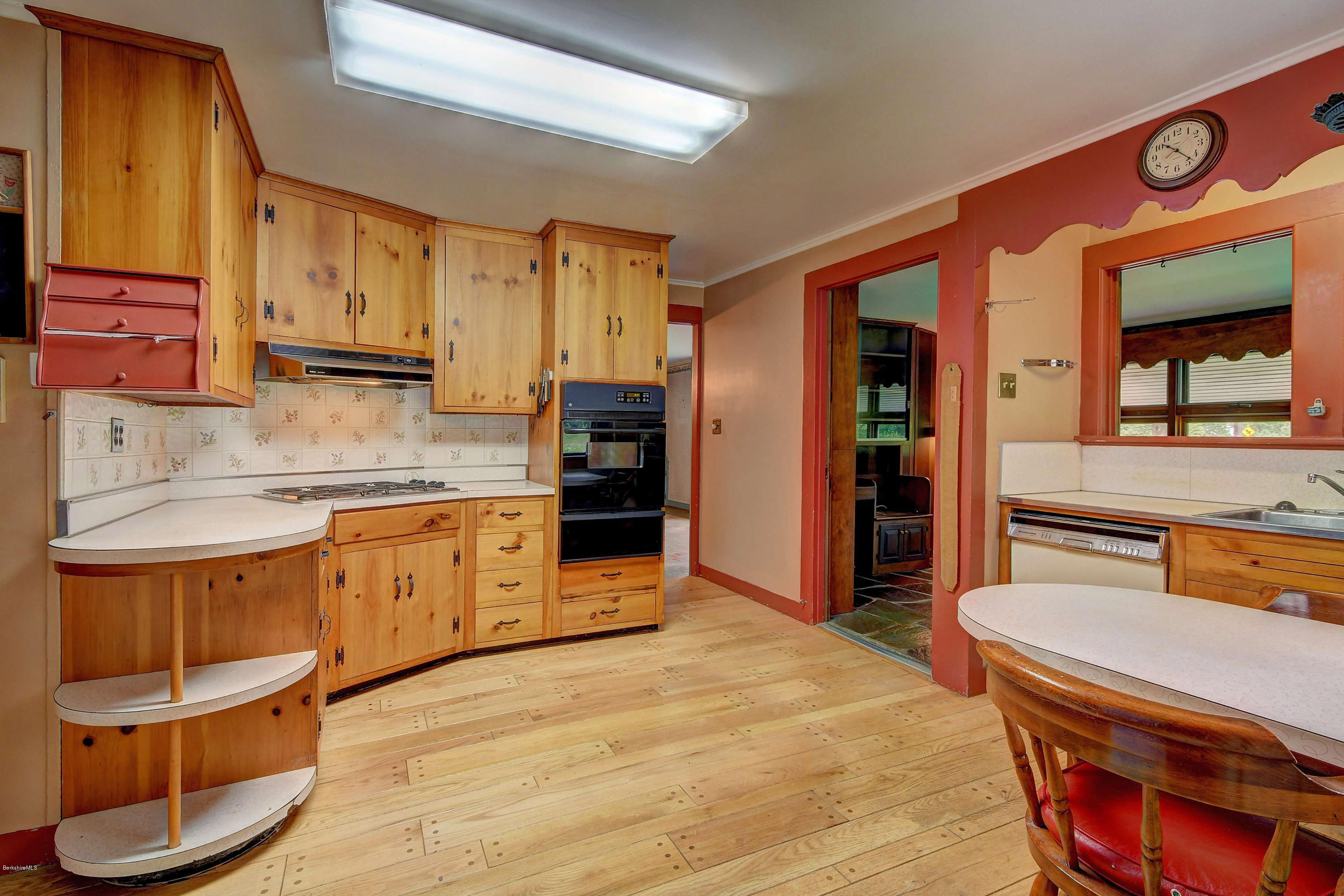 1114 Ashley Falls Road Sheffield, MA 01222 - Photo 12 of 53 a kitchen with stainless steel appliances granite countertop a stove a sink and a refrigerator
