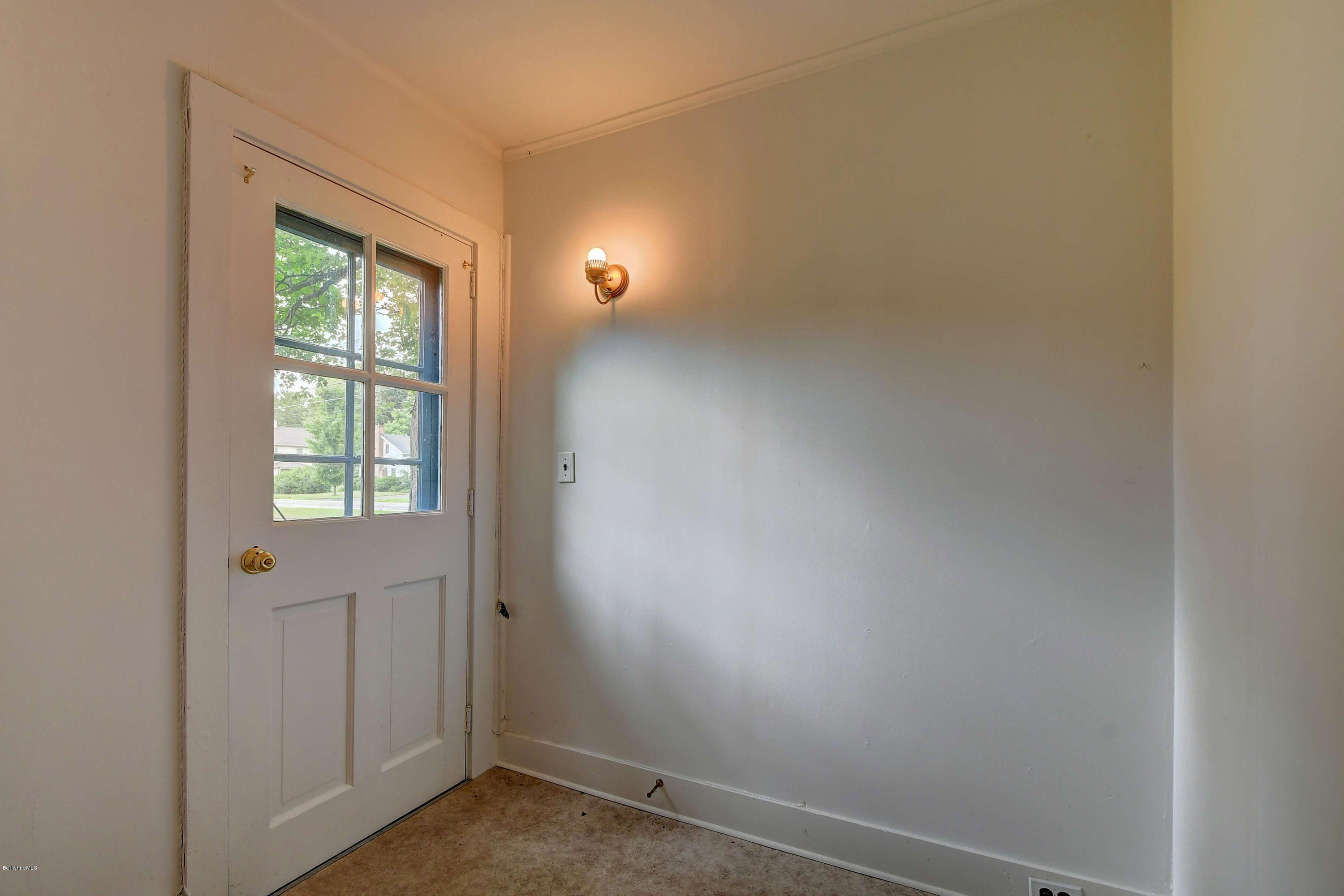 1114 Ashley Falls Road Sheffield, MA 01222 - Photo 24 of 53 a view of an empty room with a window