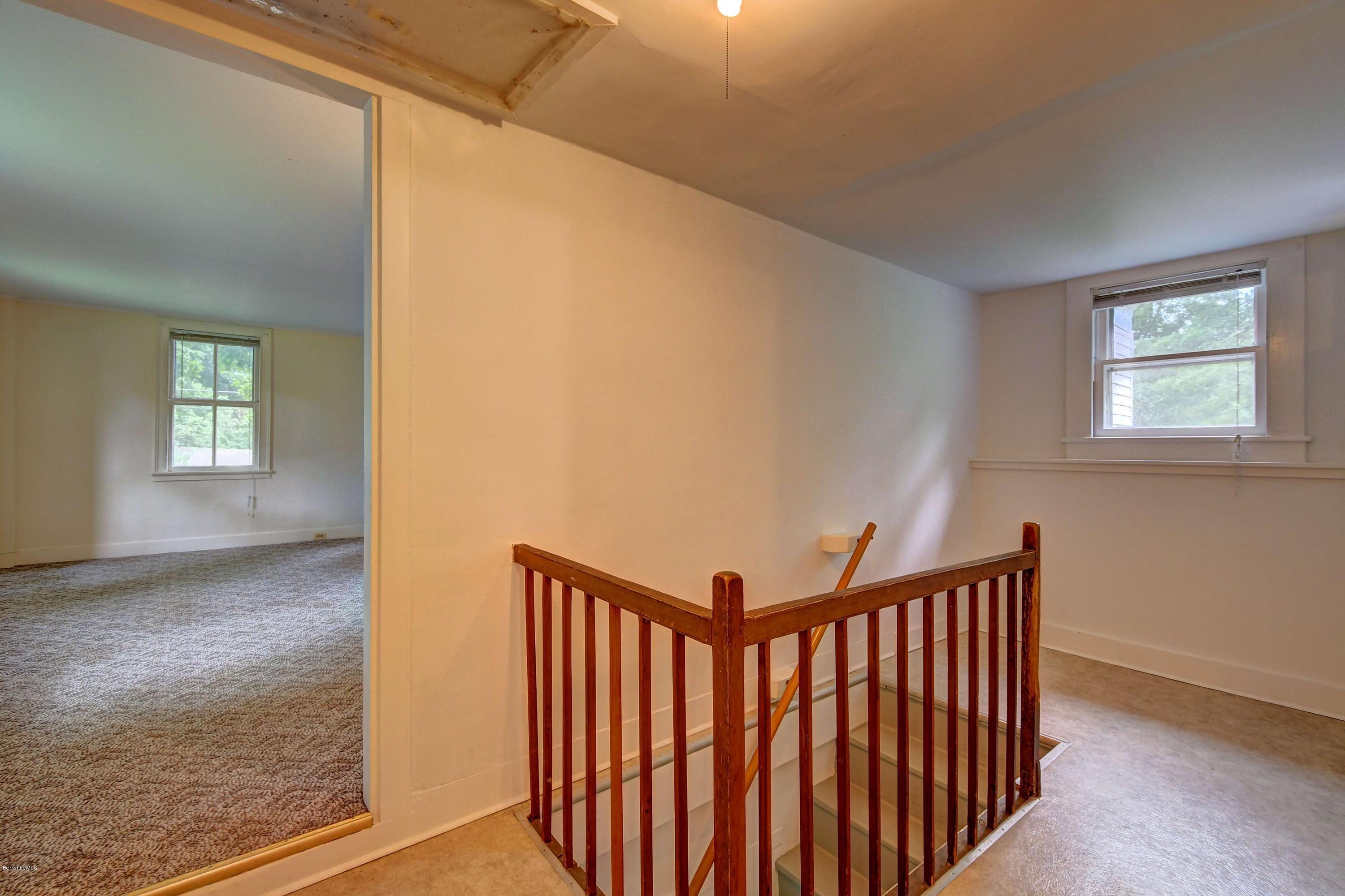 1114 Ashley Falls Road Sheffield, MA 01222 - Photo 25 of 53 a view of a hallway with windows