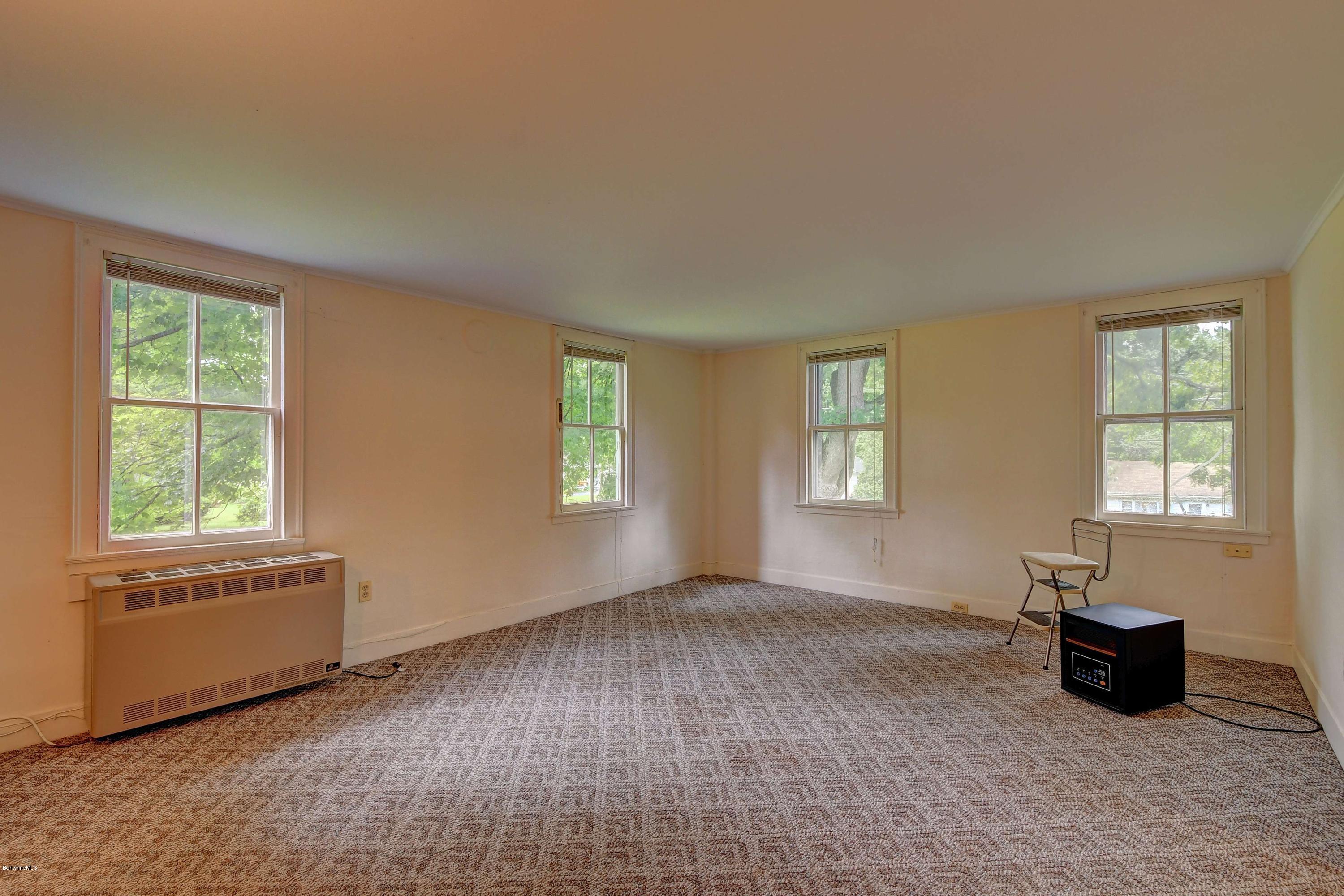 1114 Ashley Falls Road Sheffield, MA 01222 - Photo 26 of 53 a view of an empty room with a window