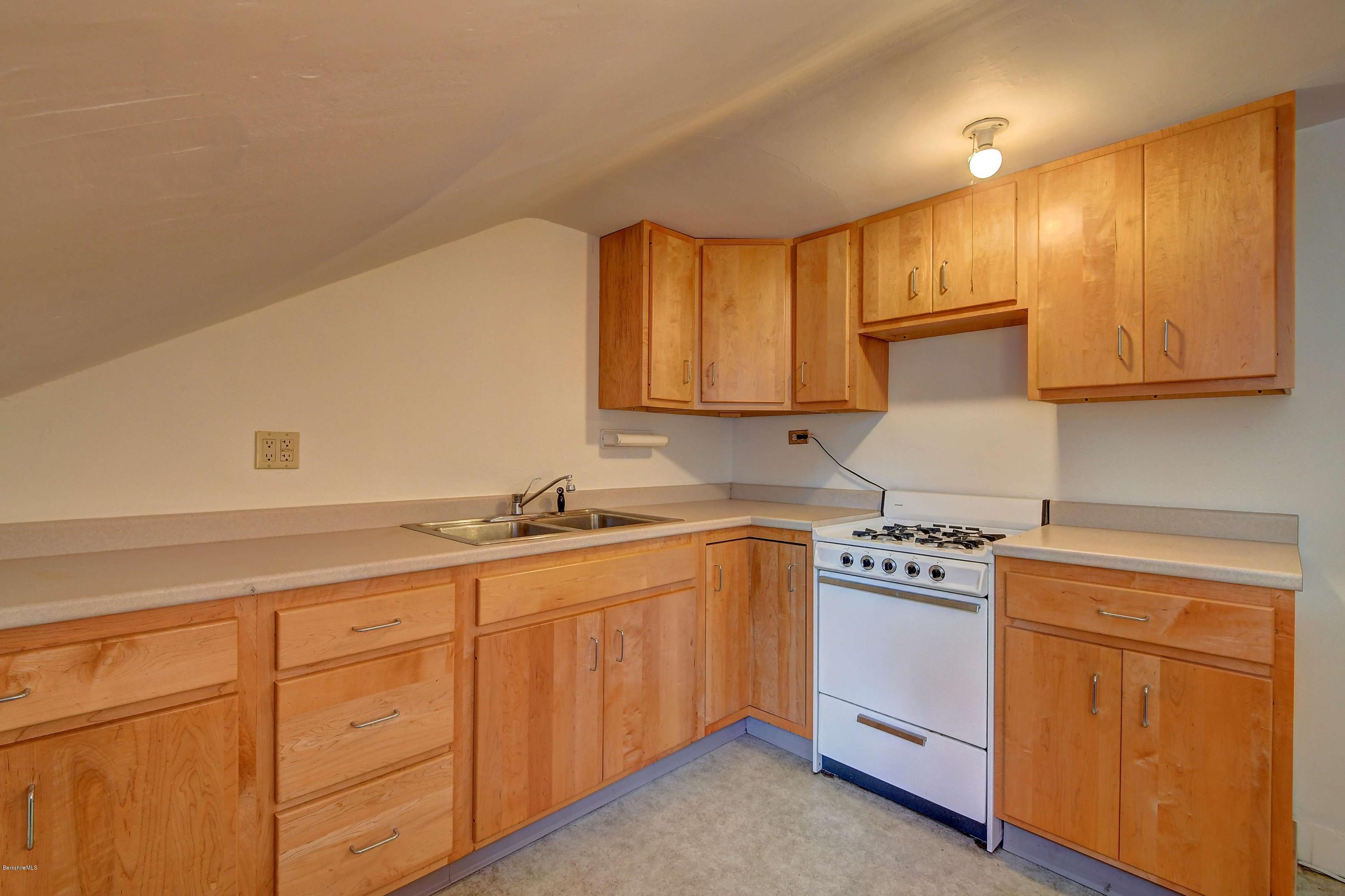 1114 Ashley Falls Road Sheffield, MA 01222 - Photo 29 of 53 a kitchen with sink a stove and cabinets