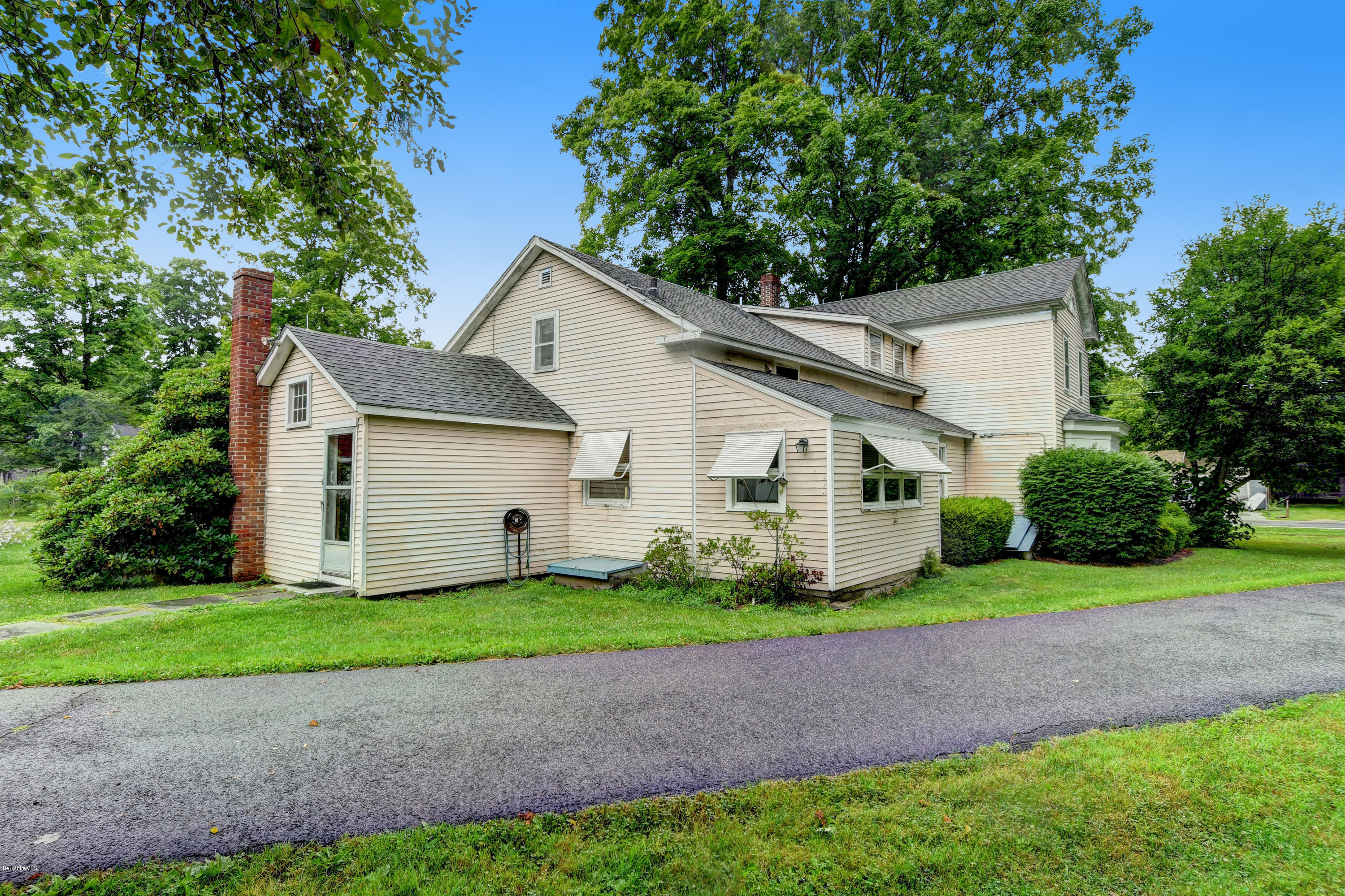 1114 Ashley Falls Road Sheffield, MA 01222 - Photo 4 of 53 a front view of a house with a garden and yard