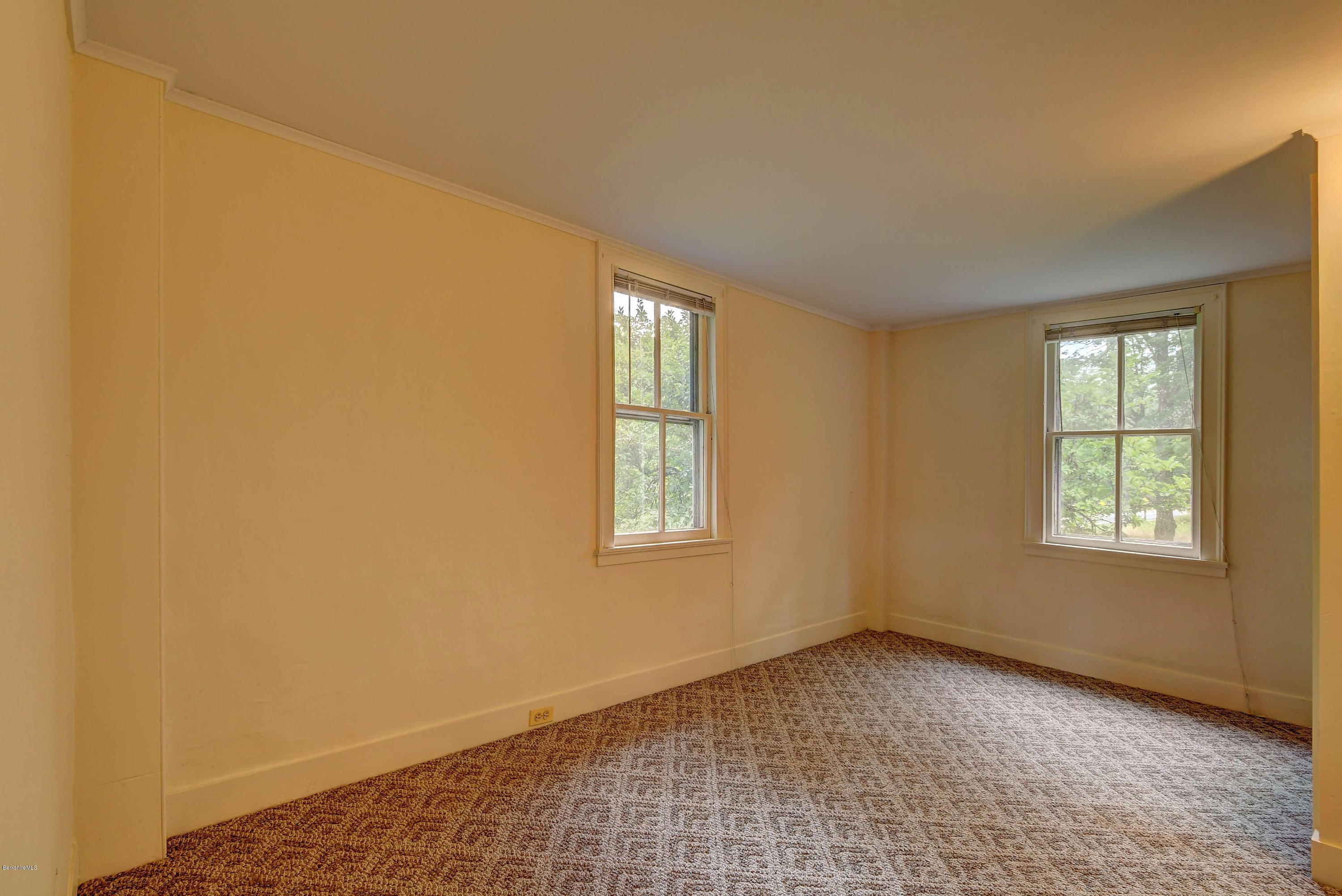 1114 Ashley Falls Road Sheffield, MA 01222 - Photo 31 of 53 a view of an empty room with a window