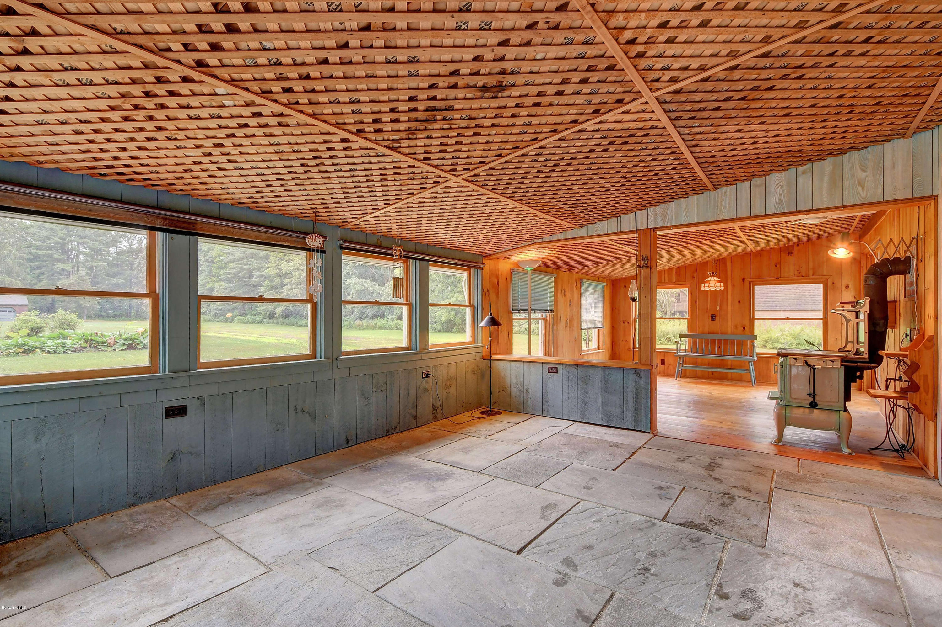 1114 Ashley Falls Road Sheffield, MA 01222 - Photo 38 of 53 a bathroom with a tub and next to a large window