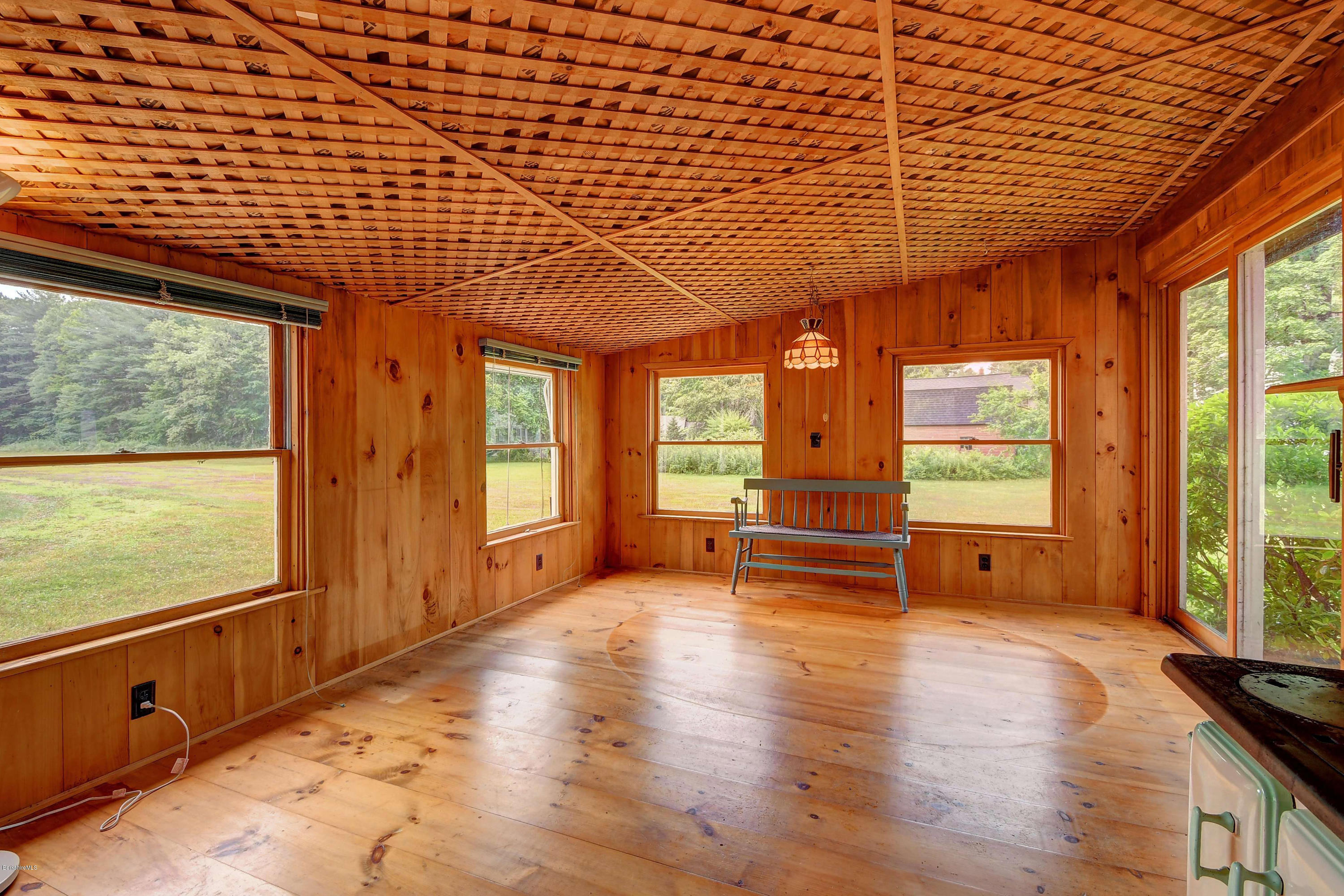 1114 Ashley Falls Road Sheffield, MA 01222 - Photo 40 of 53 a view of an empty room with a window