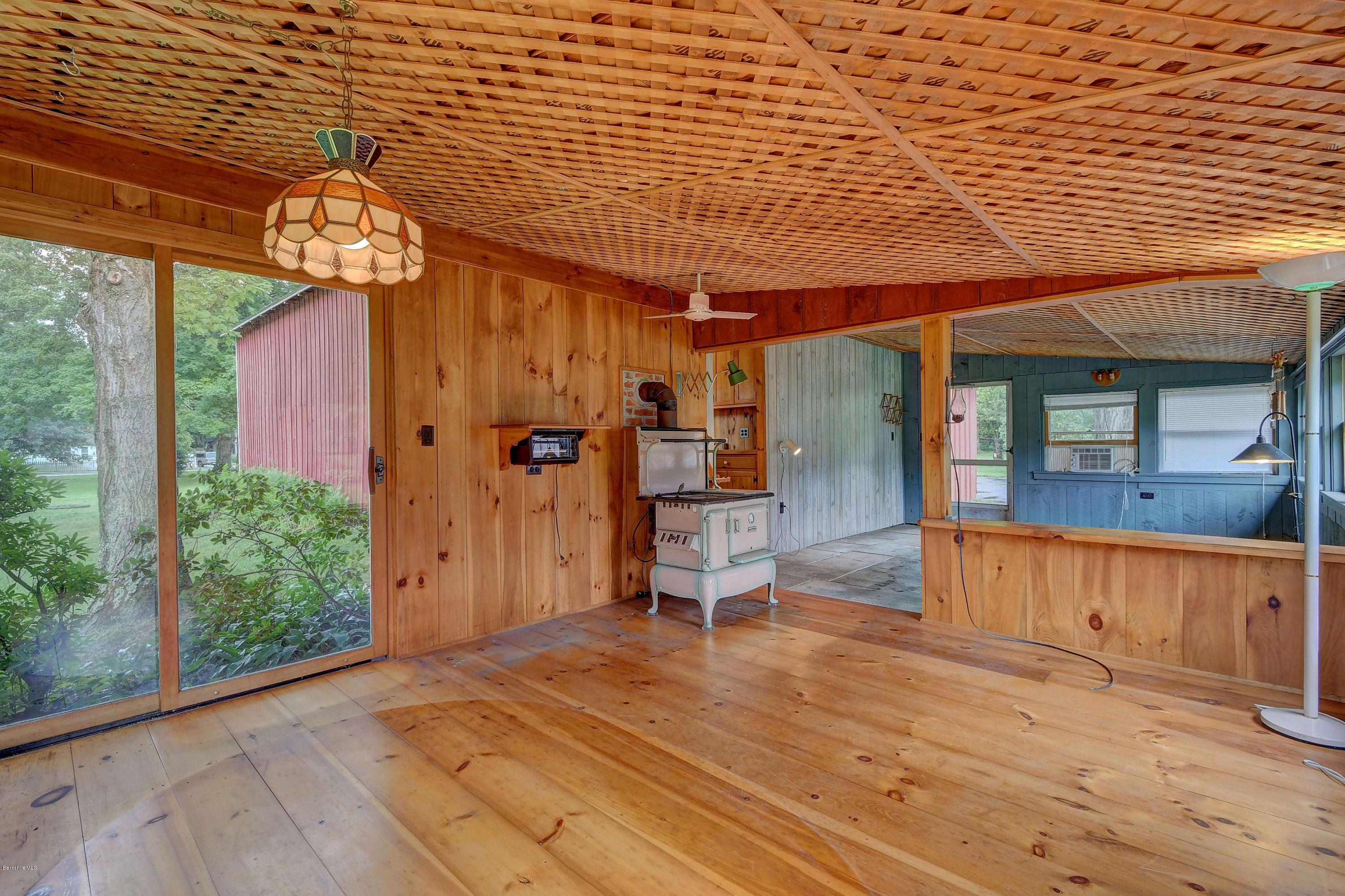 1114 Ashley Falls Road Sheffield, MA 01222 - Photo 41 of 53 a view of a chairs and table in a patio