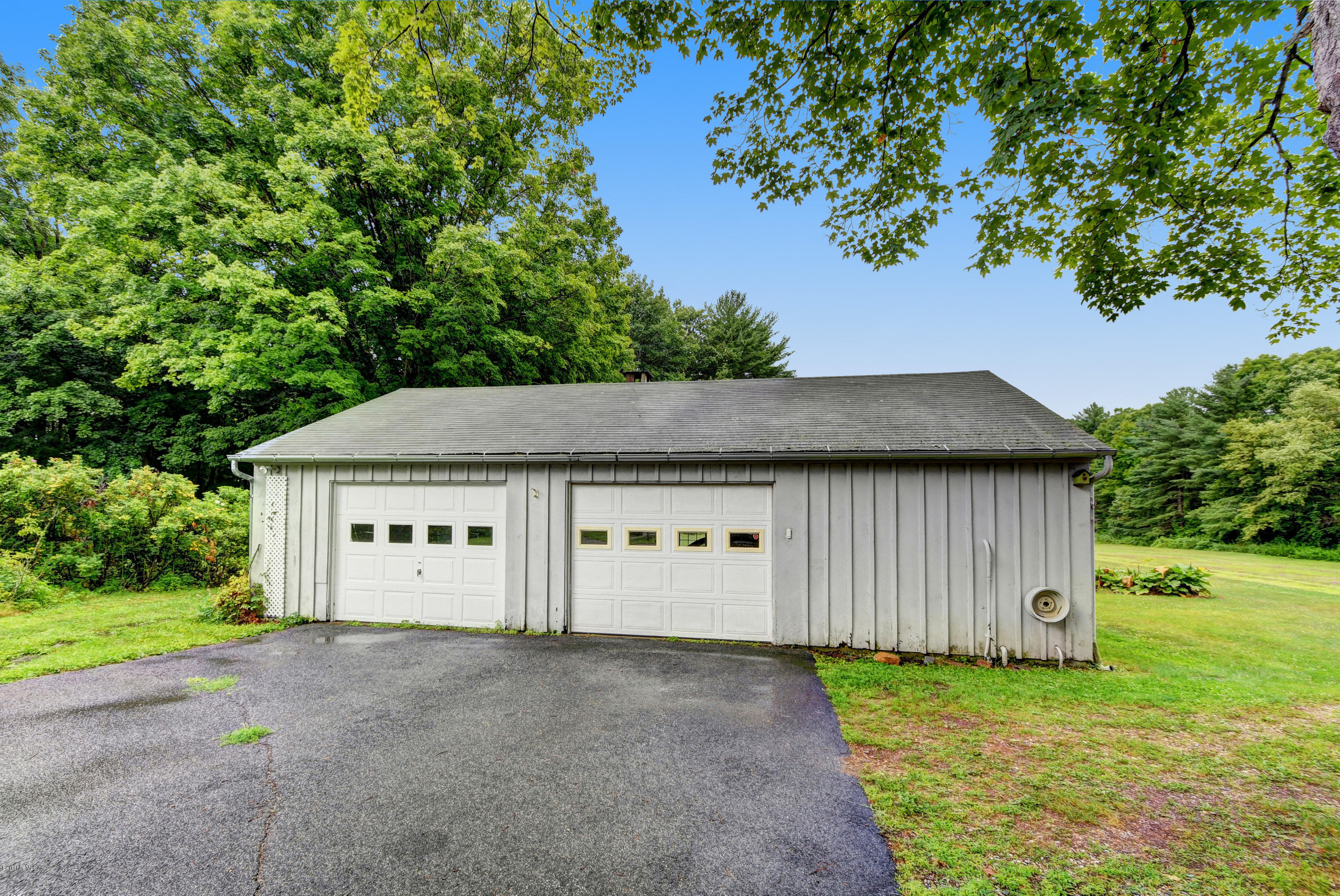 1114 Ashley Falls Road Sheffield, MA 01222 - Photo 46 of 53 a view of a house with a yard and garage