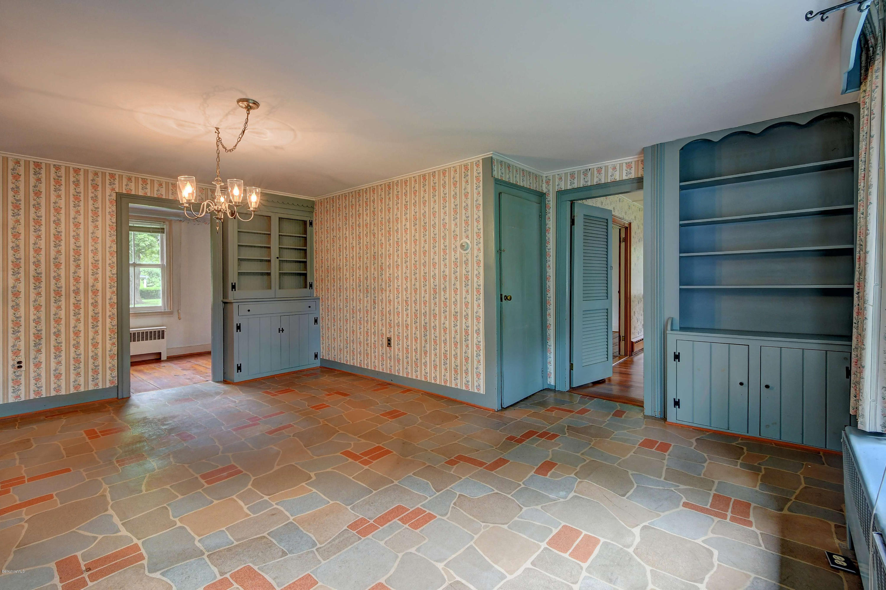1114 Ashley Falls Road Sheffield, MA 01222 - Photo 10 of 53 a view of an empty room with a fireplace