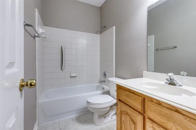 a bathroom with a sink a toilet and a bathtub