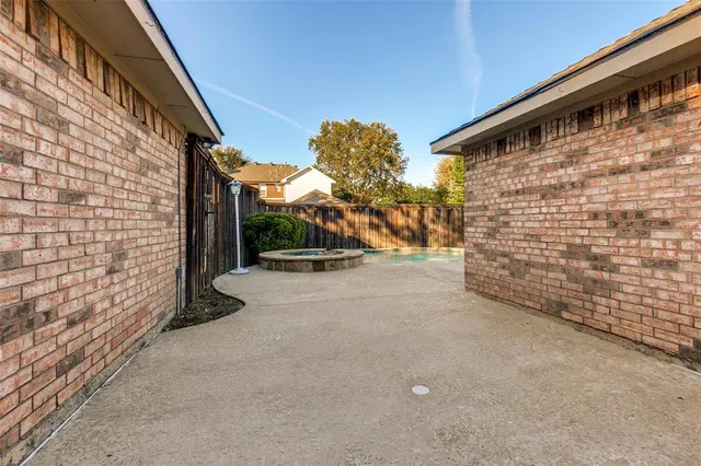a view of a backyard with a garden
