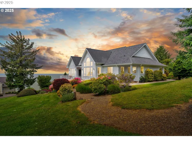 a aerial view of a house with a yard and a garden
