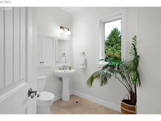 a bathroom with a sink a mirror and a toilet