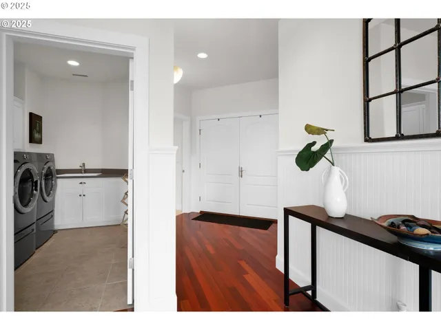 a kitchen with stainless steel appliances granite countertop a sink a stove and a refrigerator