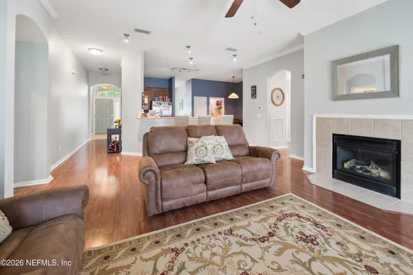 a living room with furniture and a fireplace
