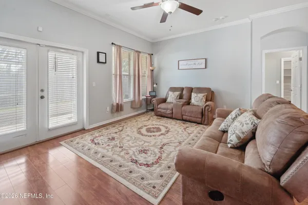 a living room with furniture and a rug