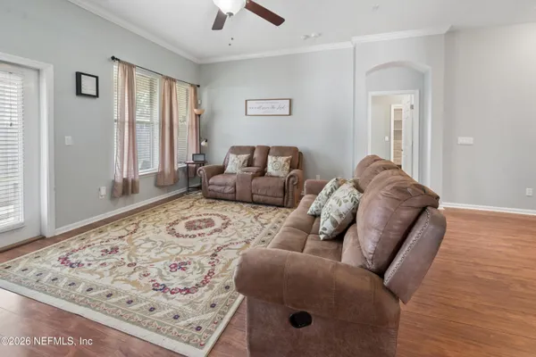 a living room with furniture and a rug