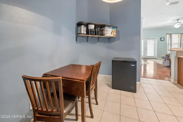 a view of kitchen with furniture and wooden floor