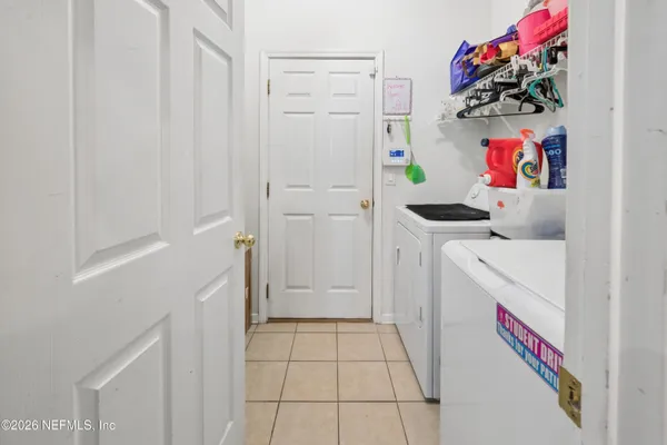 a kitchen with a refrigerator and a stove