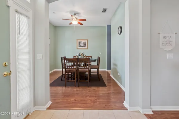 a dining room with furniture and window