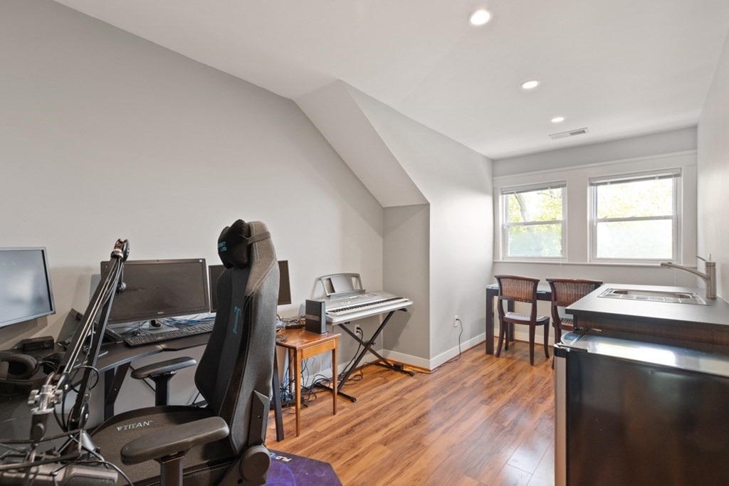 102 Addington Road, Unit 2 Brookline, MA 02445 - Photo 22 of 30 a view of a workspace with furniture and a window