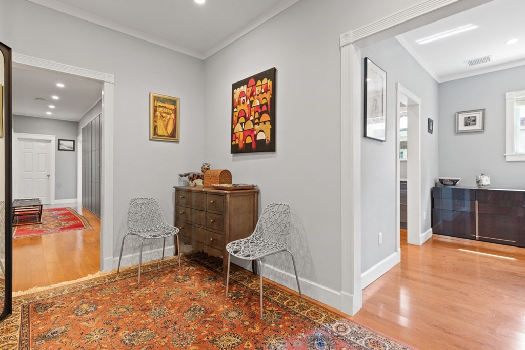 102 Addington Road, Unit 2 Brookline, MA 02445 - Photo 5 of 30 a workspace room with furniture and wooden floor