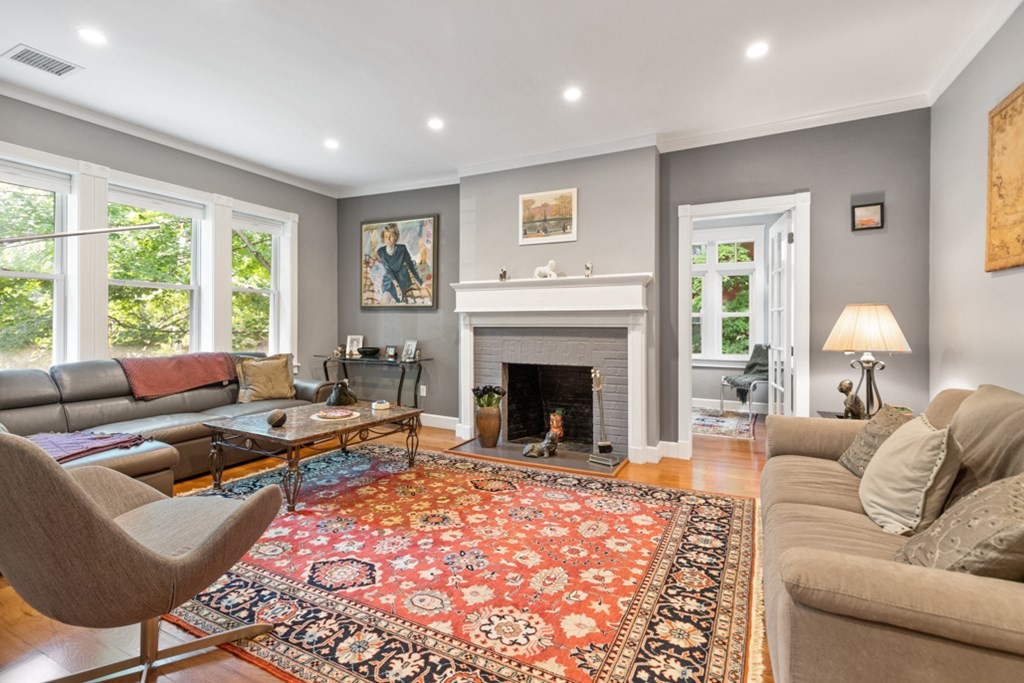 102 Addington Road, Unit 2 Brookline, MA 02445 - Photo 7 of 30 a living room with furniture fireplace and window