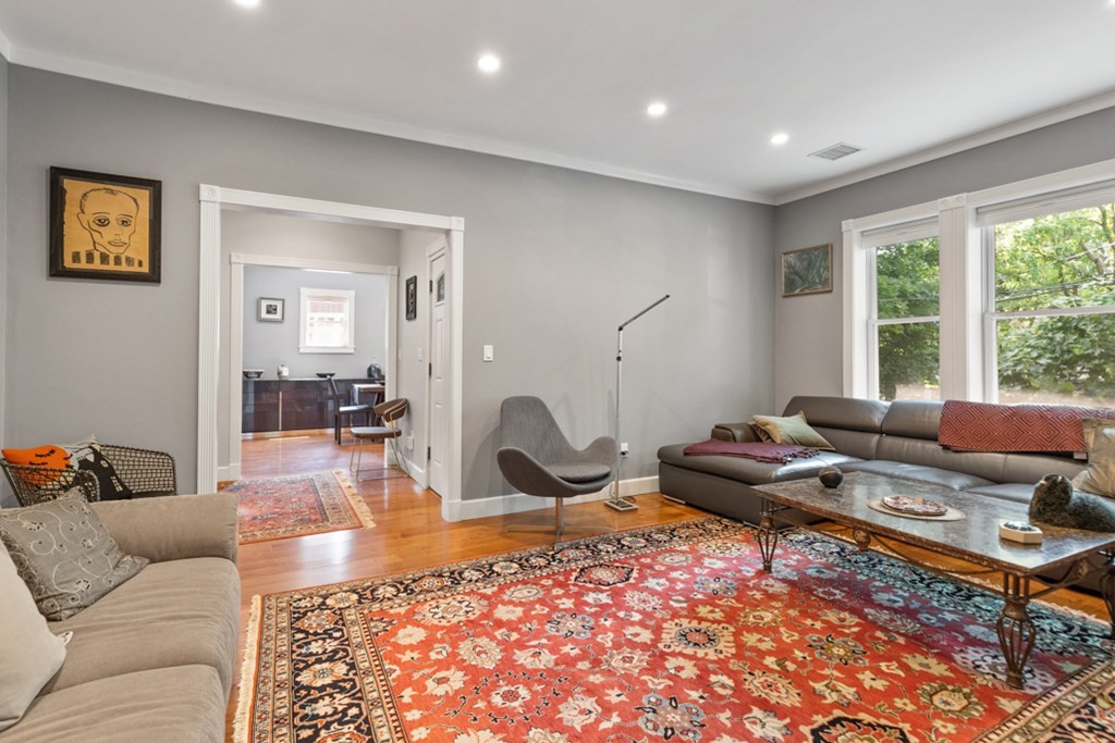 102 Addington Road, Unit 2 Brookline, MA 02445 - Photo 8 of 30 a living room with furniture a rug and a window